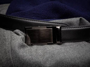 black belt strap with a black ratchet buckle