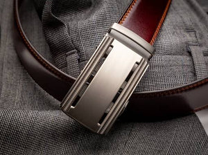 brown belt with a silver ratchet buckle